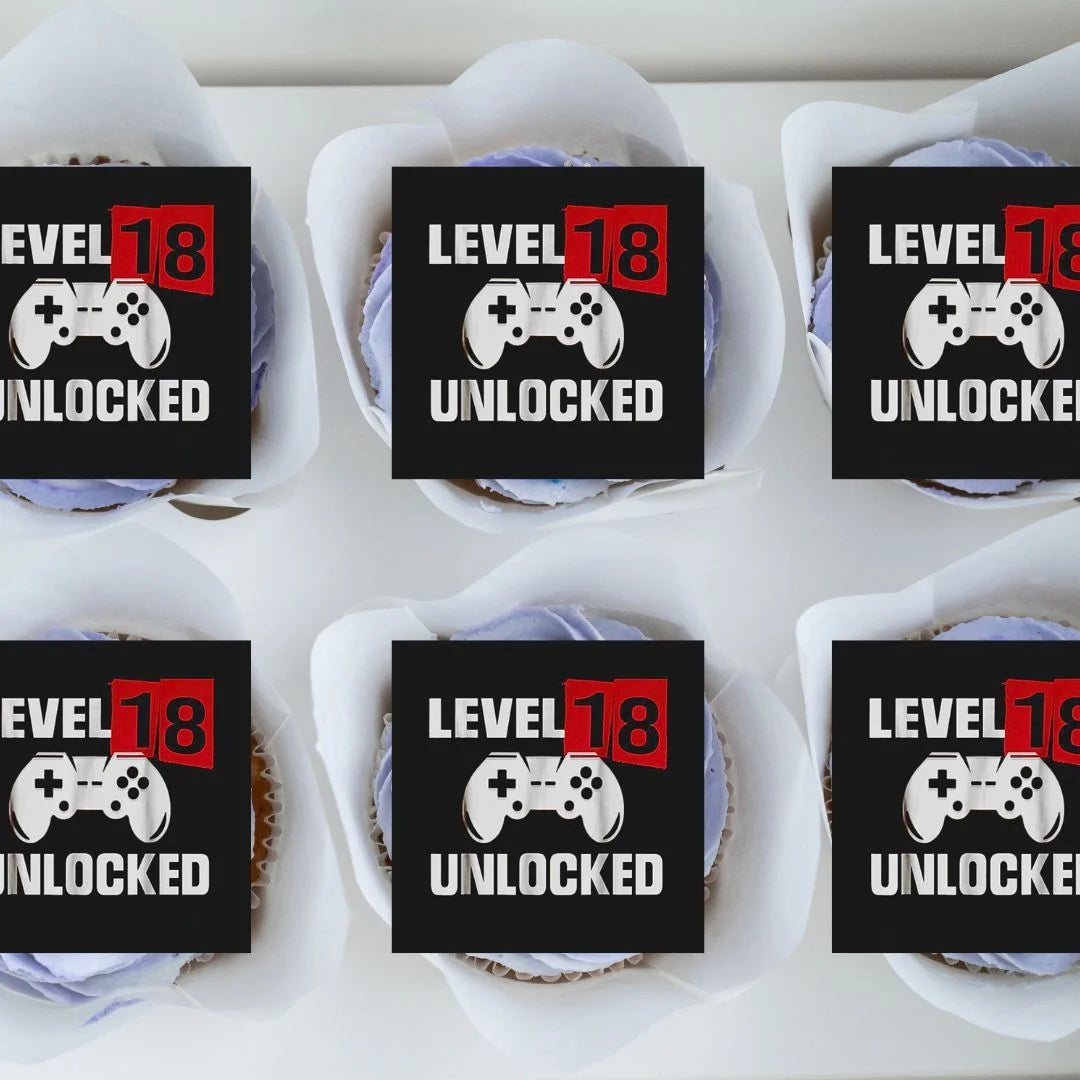 level 18 unlocked black red and white cupcake toppers on frosted cupcakes