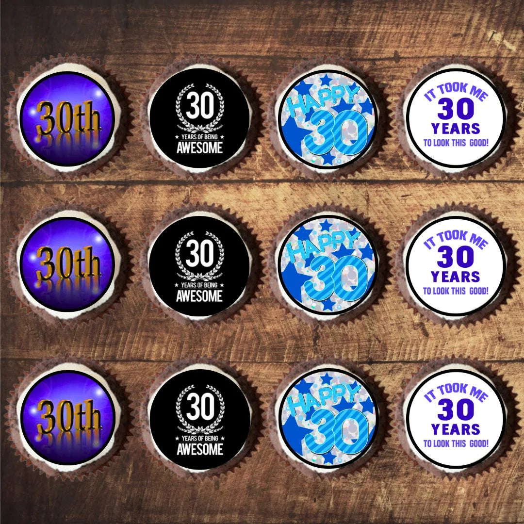 top view of blue themed 30th birthday cupcake toppers on frosted cupcakes