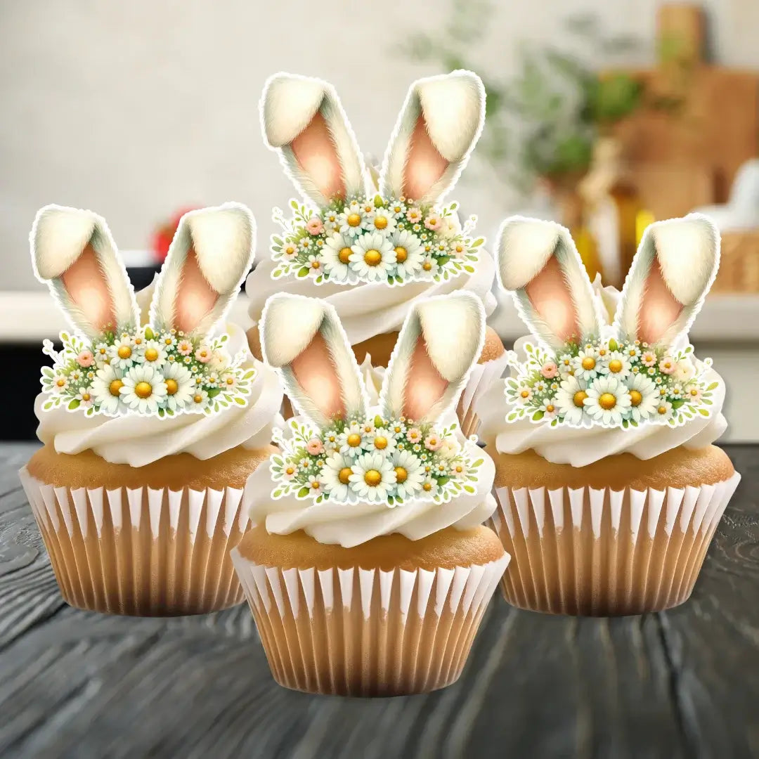 Edible bunny ears cupcake toppers with daisies, on top of white frosted cupcakes
