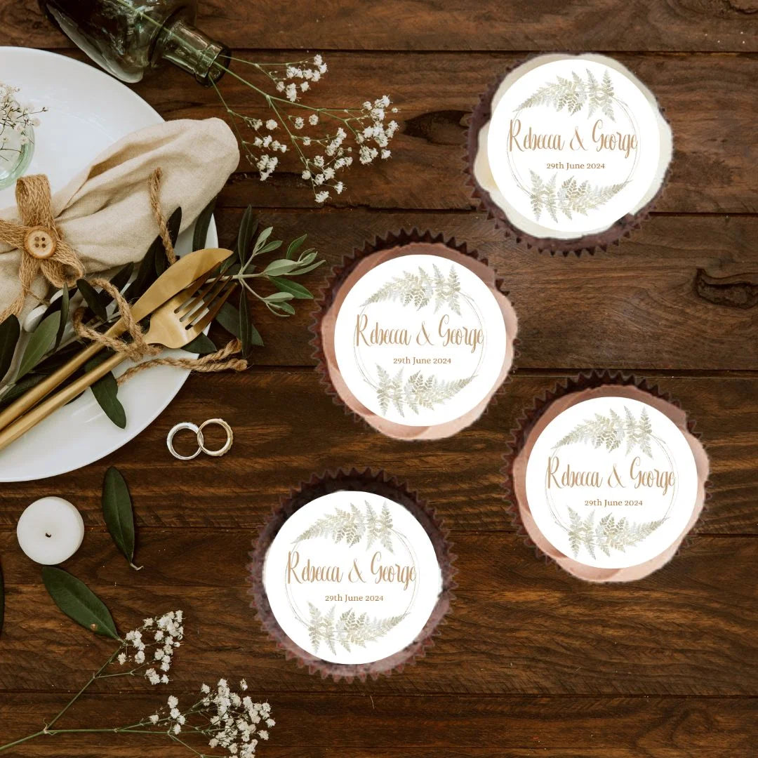 Gold Wreath Design Cupcake Toppers with personalised name and date on top of cupcakes and placed on a wedding table