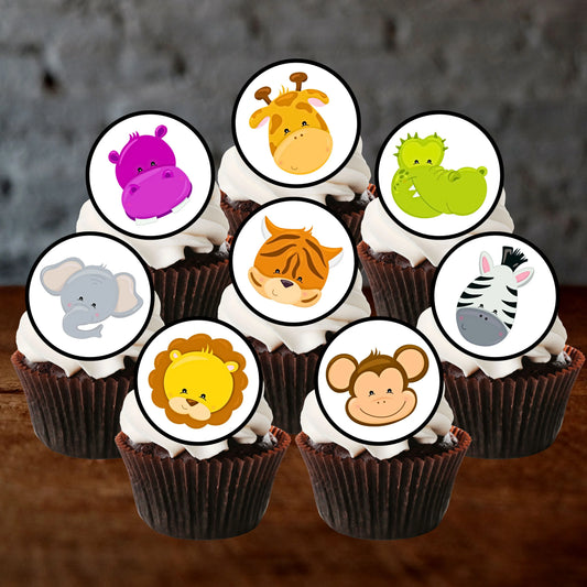 cupcakes with white frosting and cute cartoon jungle animals cupcake toppers.