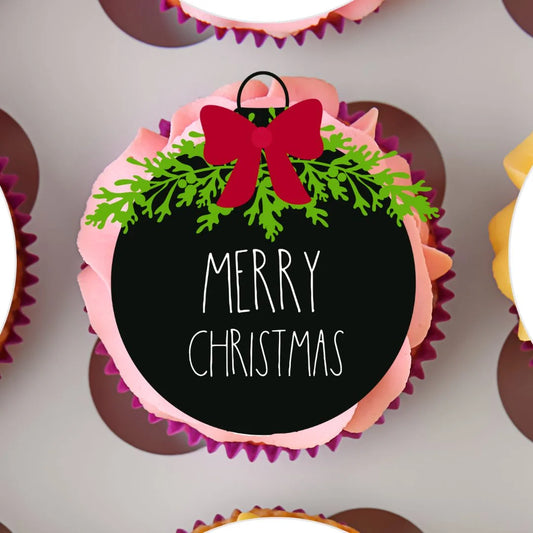 Merry Christmas Baubles Edible Cupcake Topper on a cupcake with pink frosting