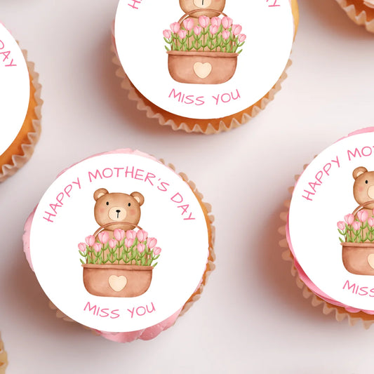 Personalised Mothers Day Cupcake Toppers with Teddy Bear designplaced on white frosted cupcakes