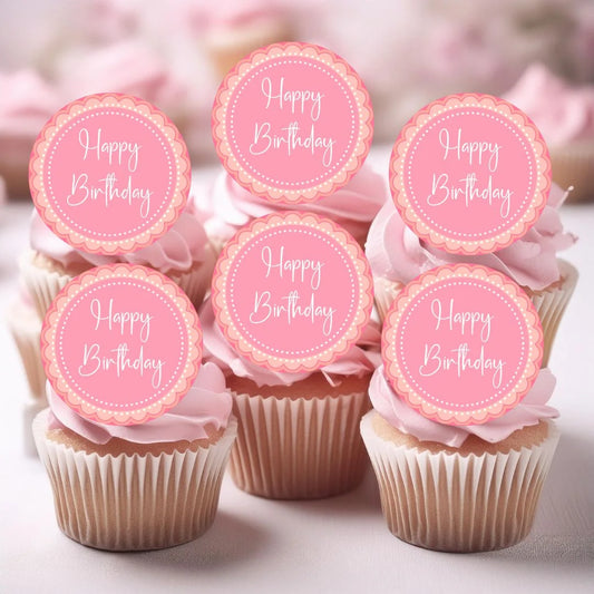 pink petal happy birthday cupcake toppers placed on pink cupcakes