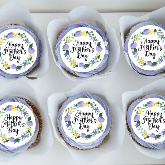 Purple Floral Mothers Day Cupcake Toppers placed on purple frosted cupcakes