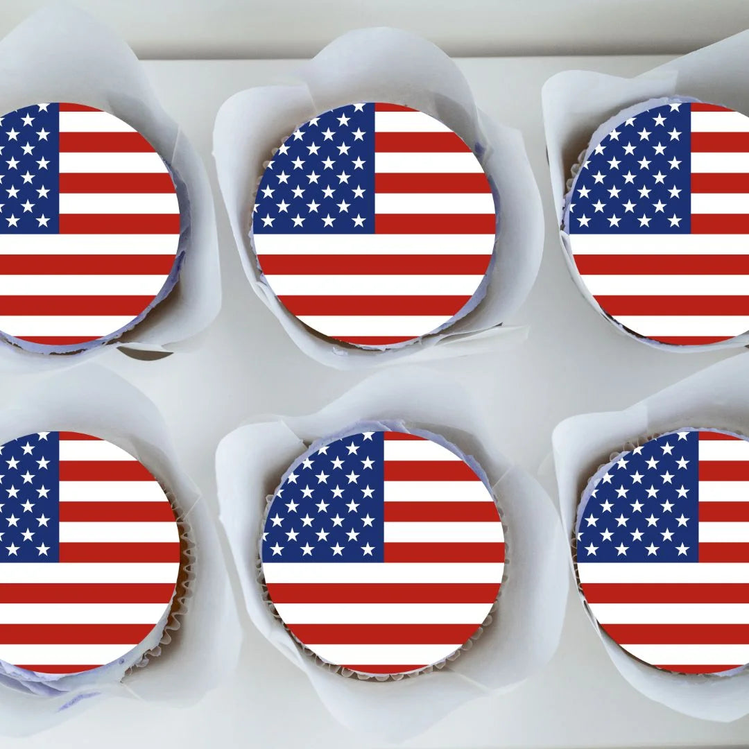 top view of American Flag Round Edible Cupcake Toppers on six cupcakes