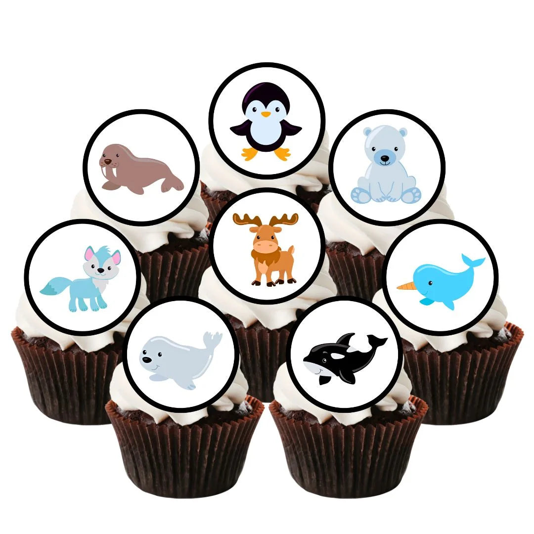 chocolate cupcakes with white frosting and arctic themed animal cake toppers