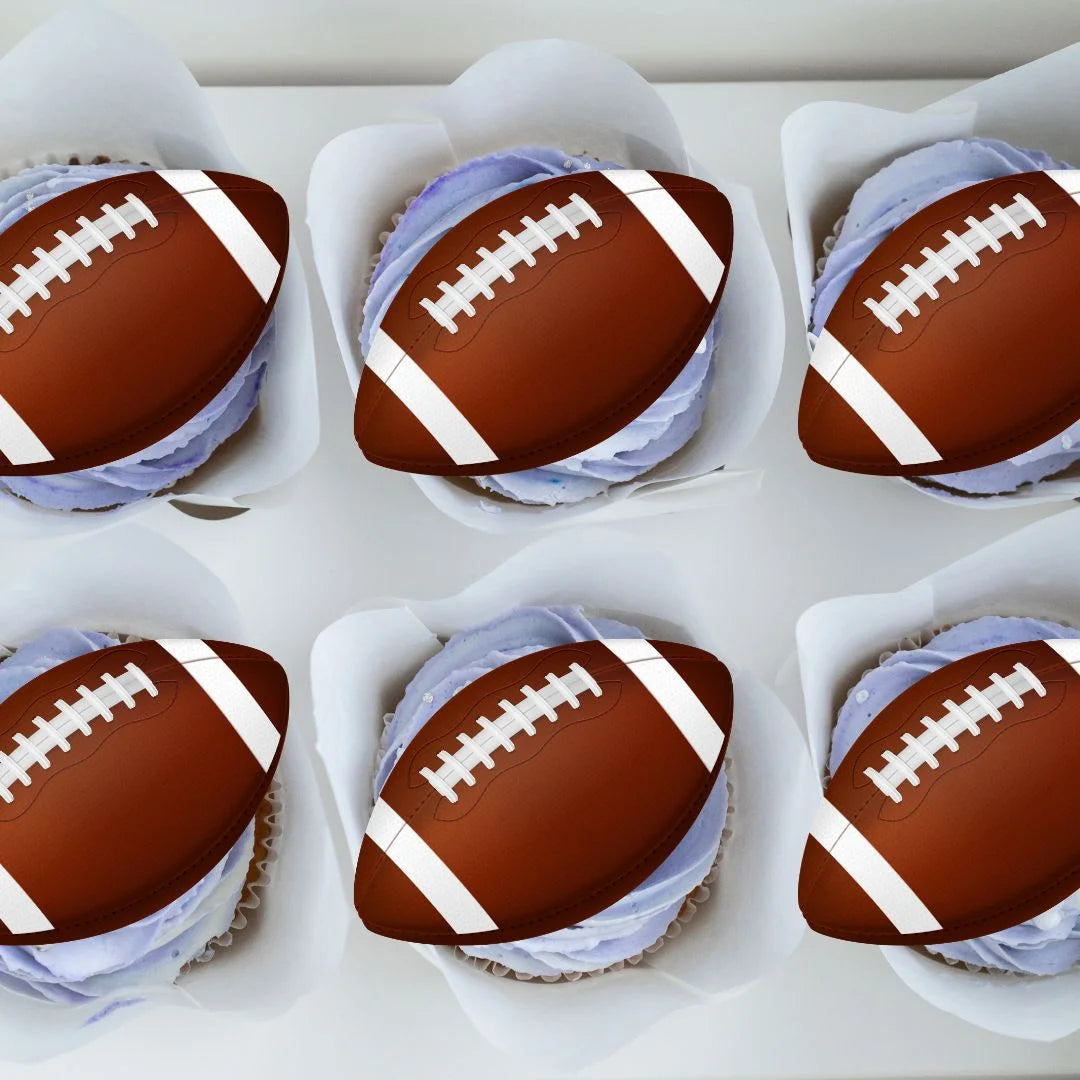 American Football Ball Edible Cupcake Toppers on white frosted cupcakes