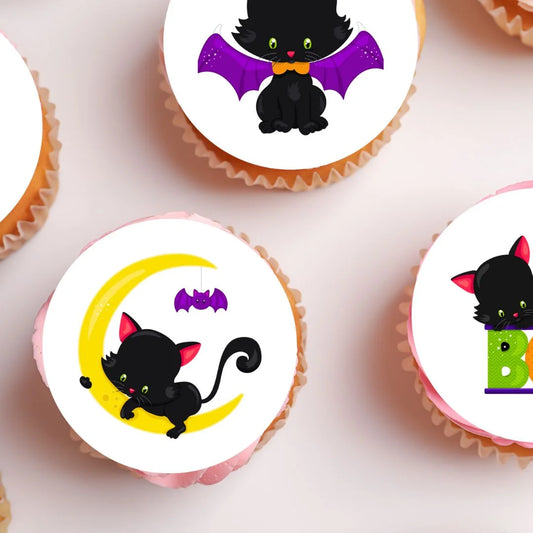 Halloween Cats Theme Edible Cupcake Toppers on white frosted cupcakes