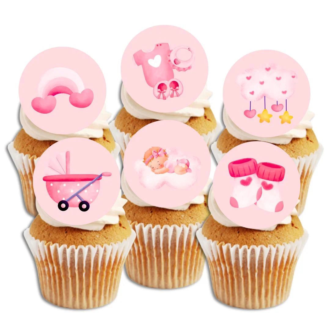 pink wafer cupcake toppers with cute girl themed illustrations on top of white frosted cupcakes