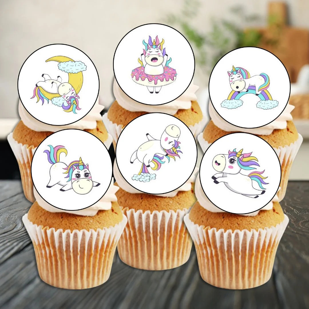 cute unicorn illustrated cupcake toppers on white frosted cupcakes