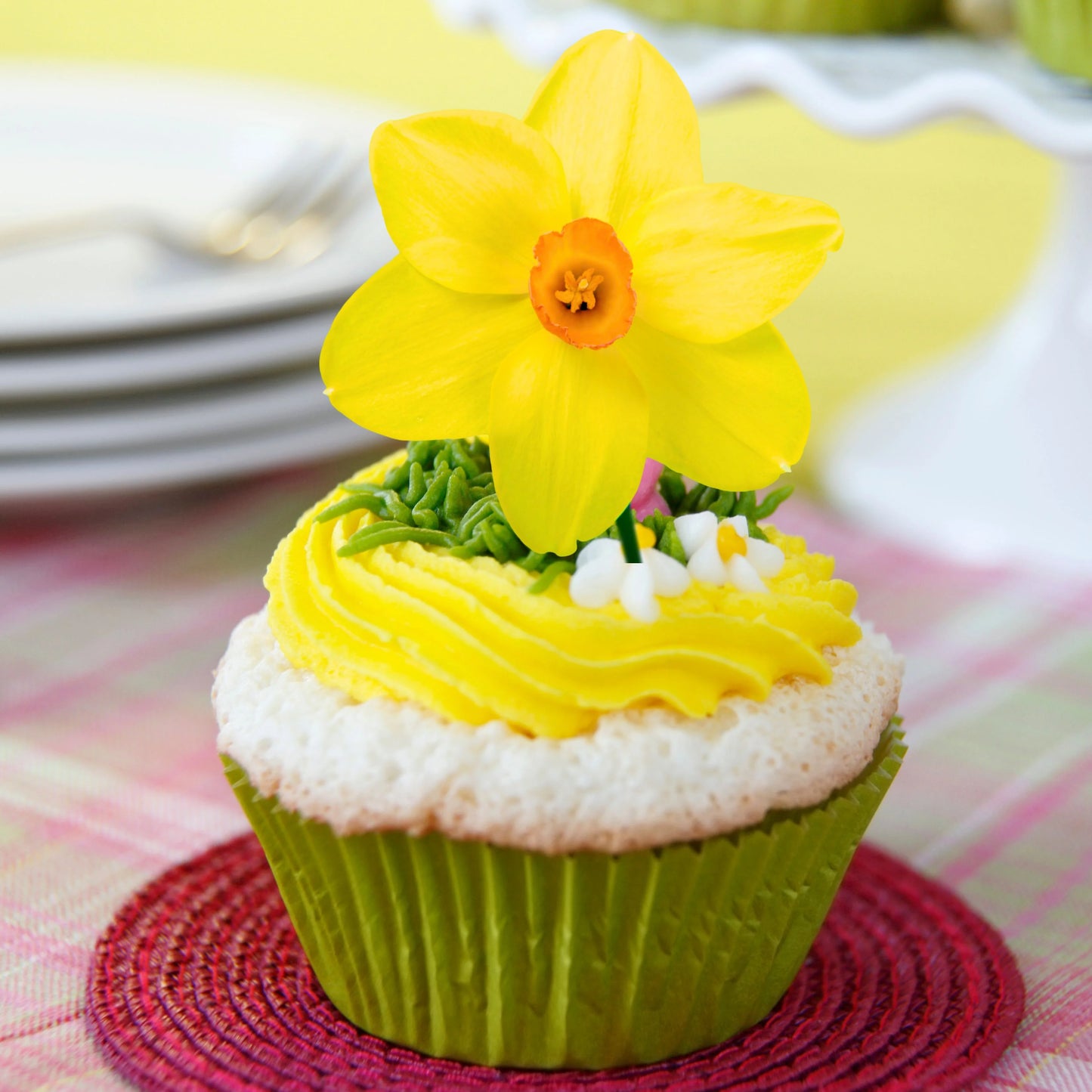 Daffodil Edible Cupcake Toppers on chocolate cupcakes with white frosting