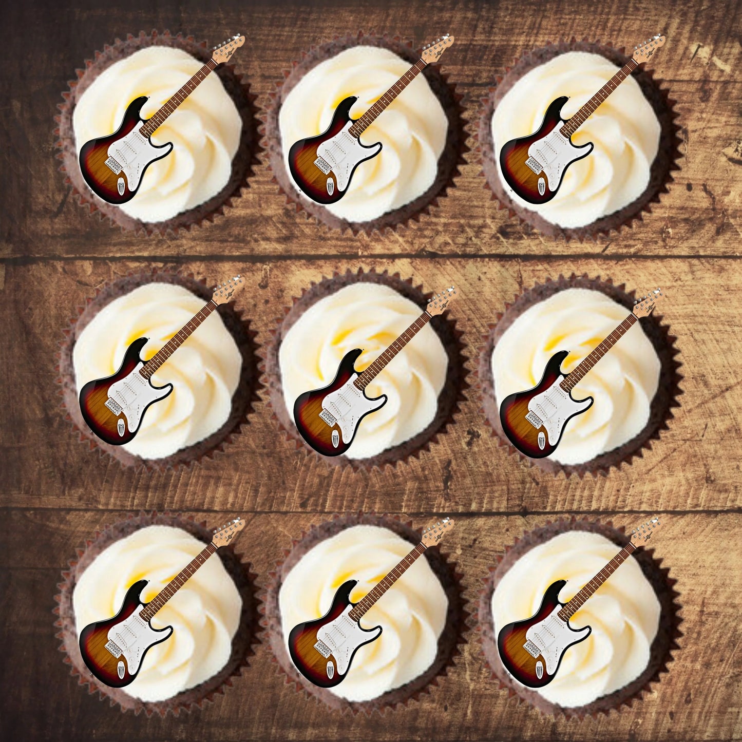 Electric Guitar Edible Cupcake Toppers on chocolate cupcakes with white frosting