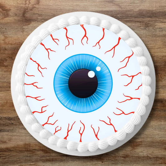 Halloween Eyeballs Edible Cupcake Toppers on a large cake with white frosting