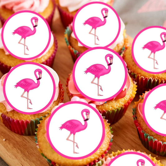 close up of frosted cupcakes with bright pink flamingo edible cake toppers