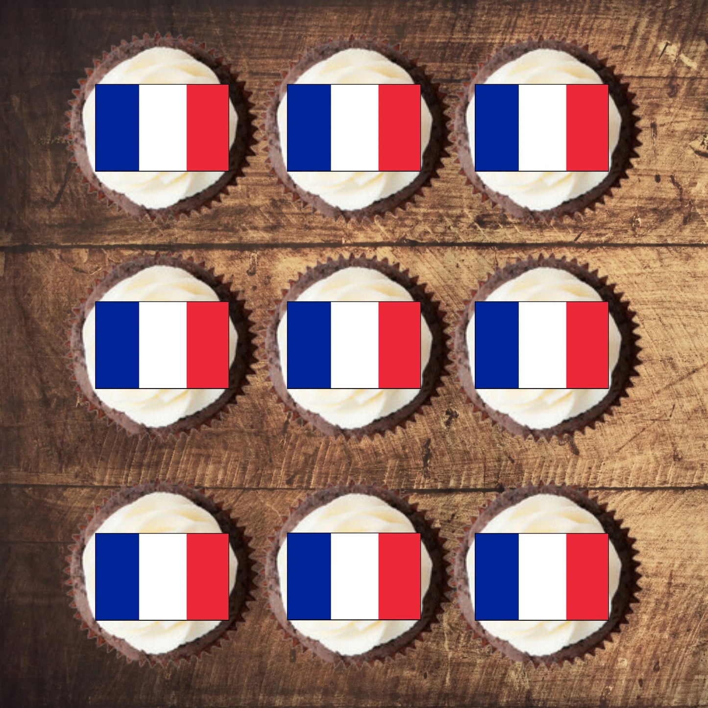 French Flag Edible Cupcake Toppers on nine white frosted cupcakes