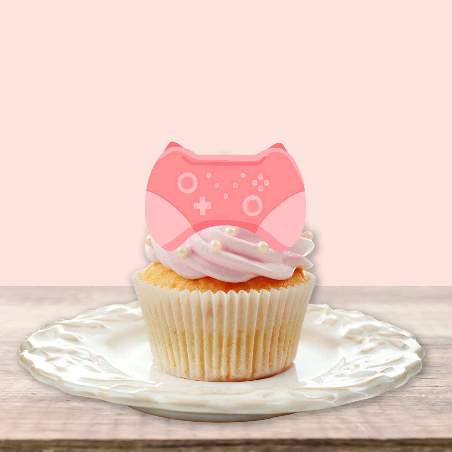 Pink Gamer Edible Cupcake Toppers on white frosted cupcakes