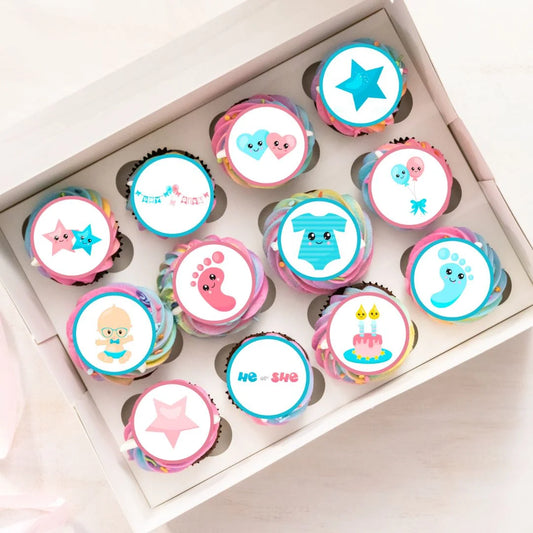 tray of rainbow frosted cupcakes topped with Gender Reveal Edible Cupcake Toppers with pink and blue illustrations