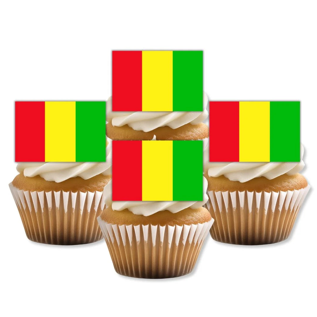 Guinea Flag Edible Cupcake Toppers on white frosted cupcakes