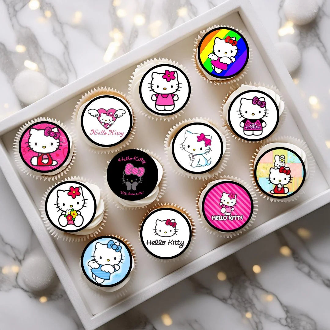 Hello Kitty Themed Edible Cupcake Toppers on white frosted cupcakes
