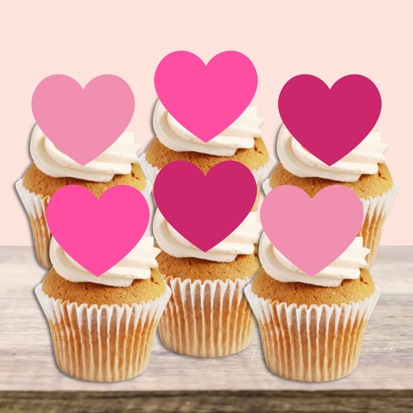 Pink Love Heart Edible Cupcake Toppers on white frosted cupcakes