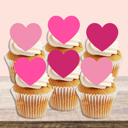 Pink Love Heart Edible Cupcake Toppers on white frosted cupcakes