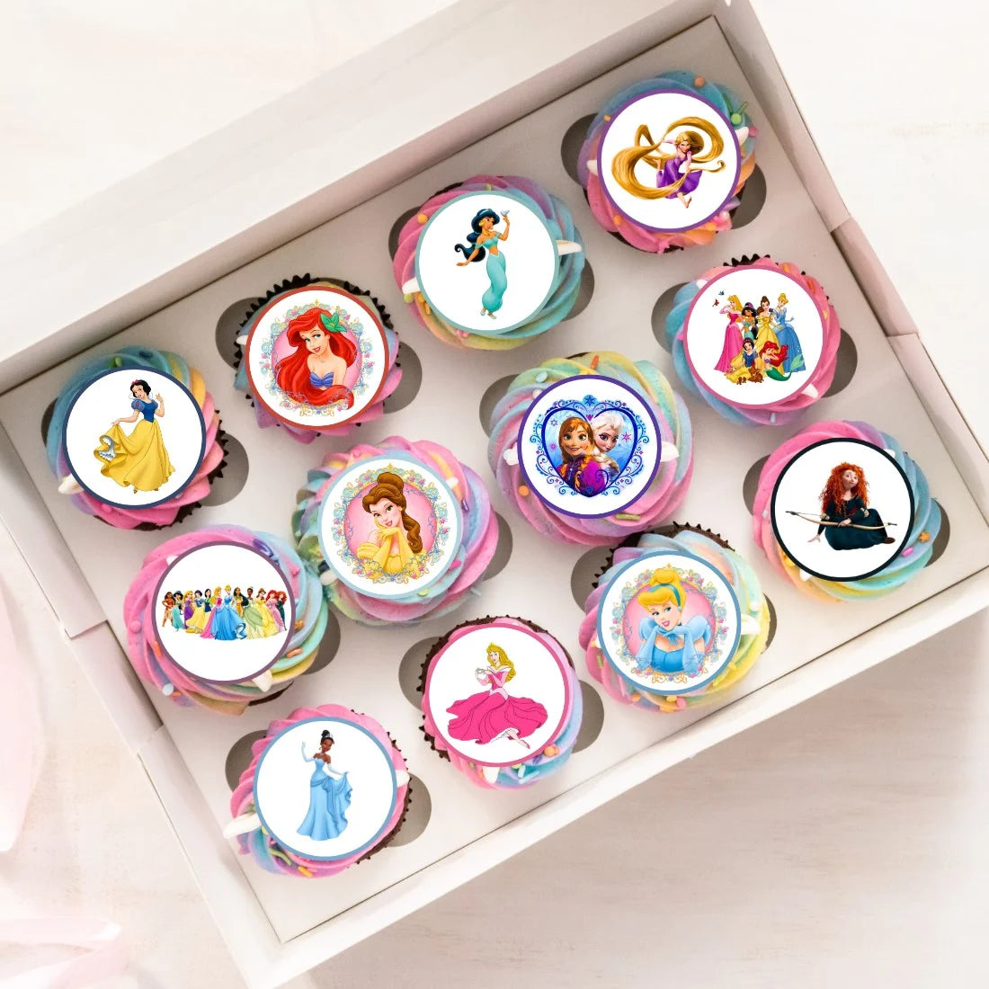 Princess Themed Edible Cupcake Toppers on cupcakes with pink frosting