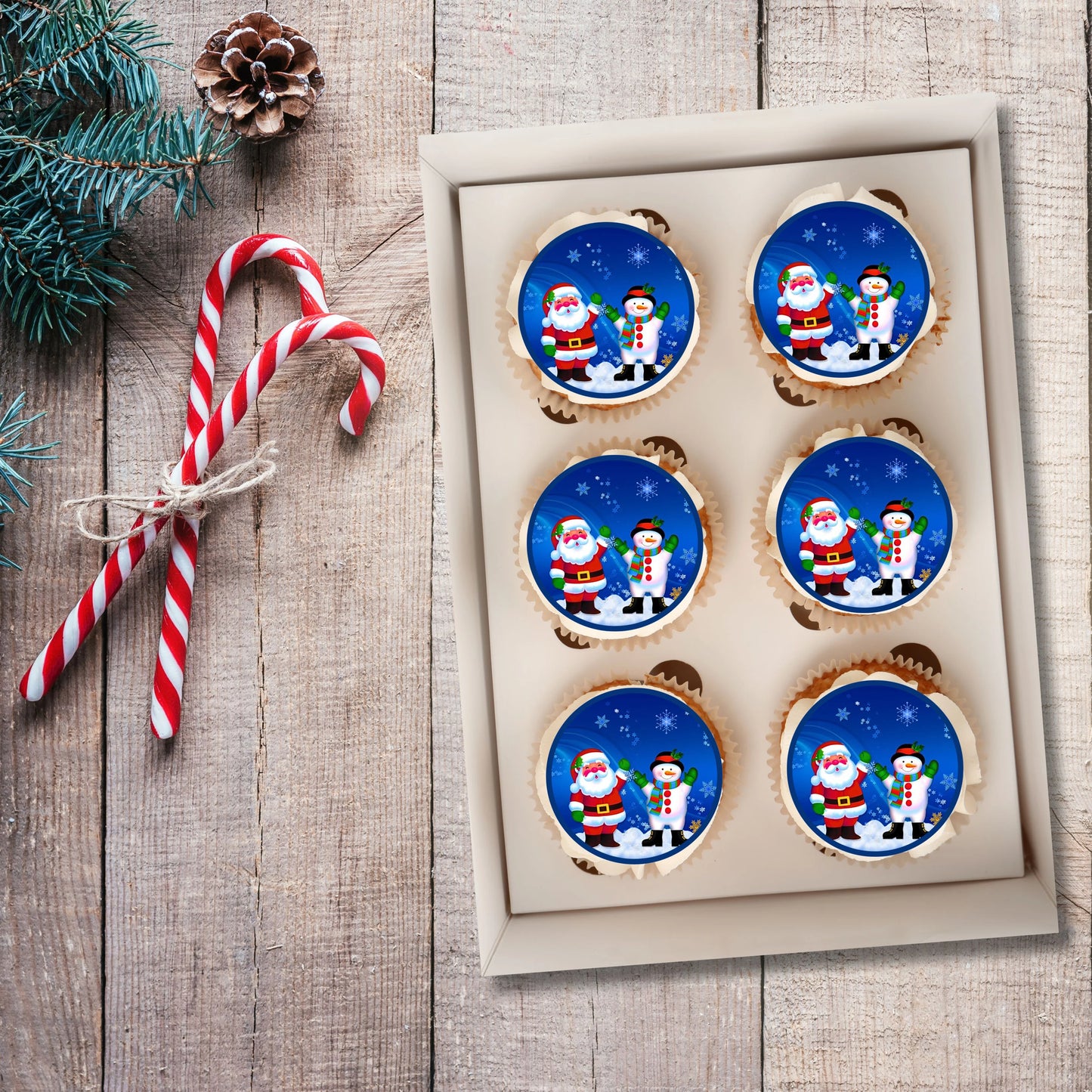 Christmas Santa Snowman Cupcake Toppers on white frosted cupcakes