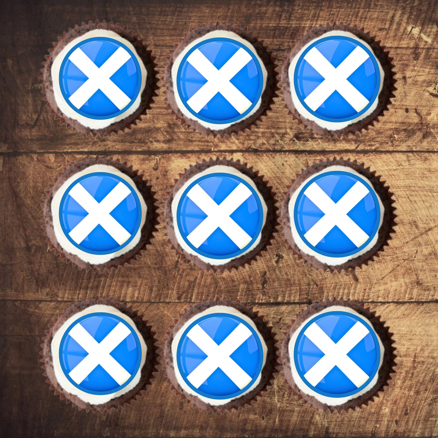 top view of Scottish Flag Edible Cupcake Toppers on chocolate cupcakes with white frosting