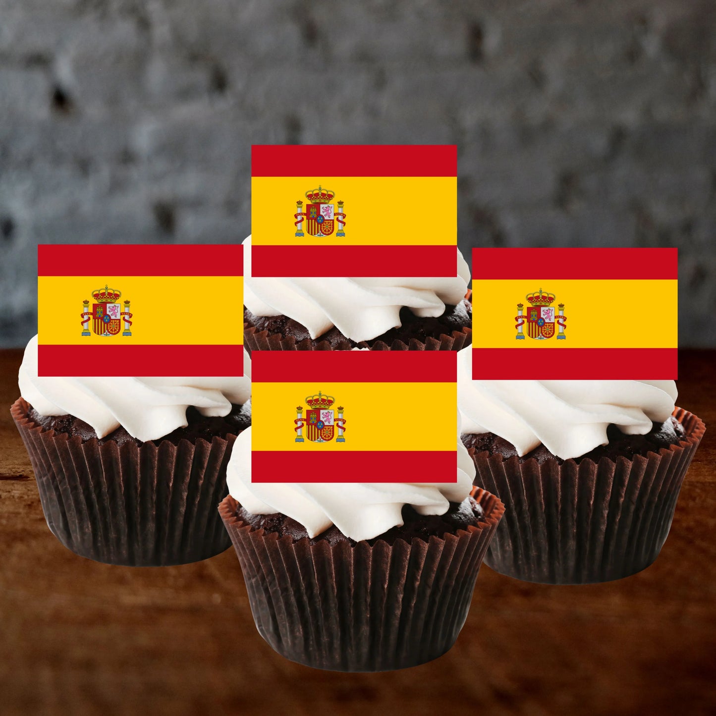 Spanish Flag Edible Cupcake Toppers on chocolate cupcakes with white frosting