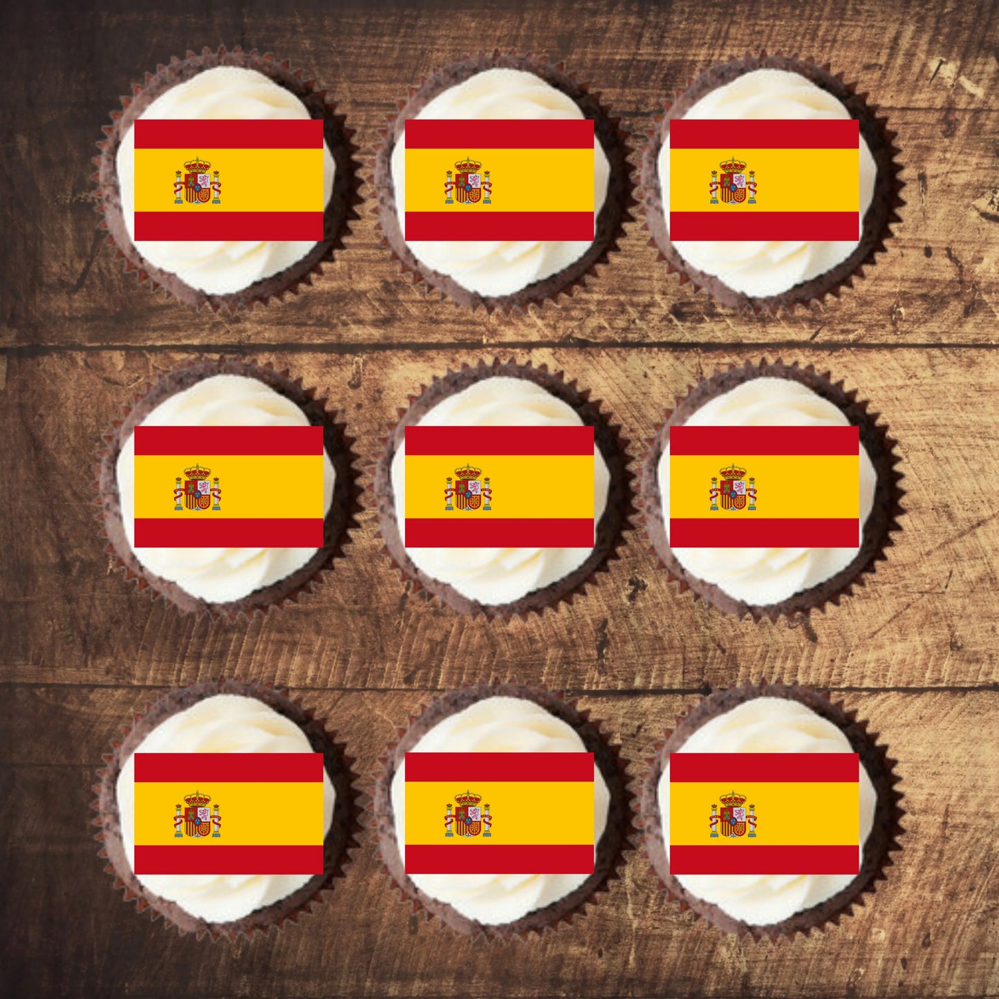 Spanish Flag Edible Cupcake Toppers on chocolate cupcakes with white frosting