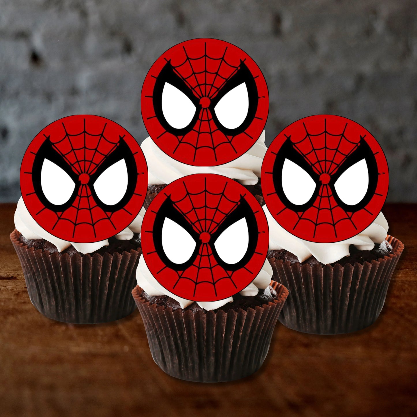 Spider-Man Face Edible Cupcake Toppers on chocolate cupcakes with white frosting