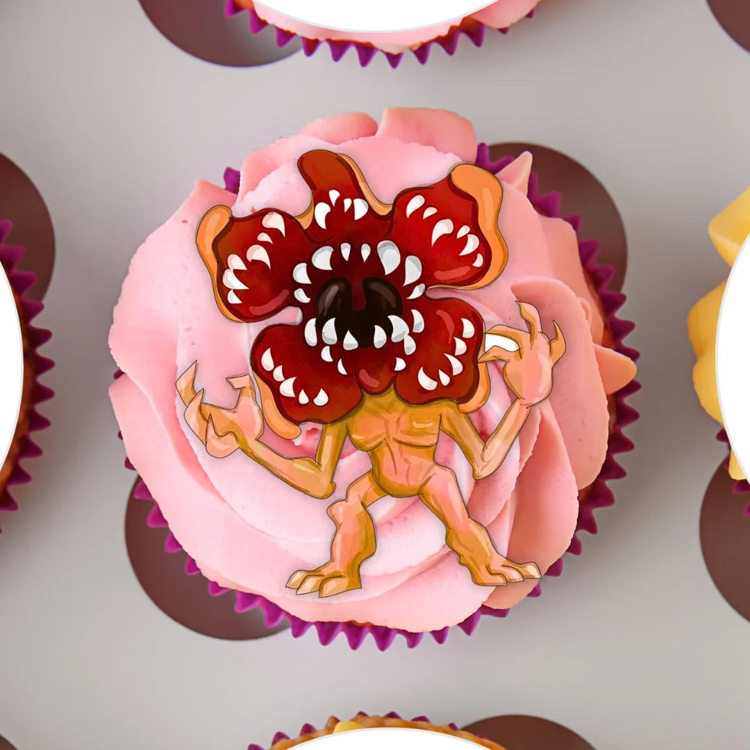 Strange Kids Edible Cupcake Toppers on a pink cupcake with frosting