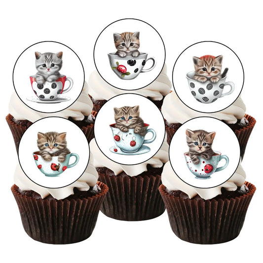 cupcakes with white frosting and illustrated cupcake toppers featuring cute cats in tea cups.