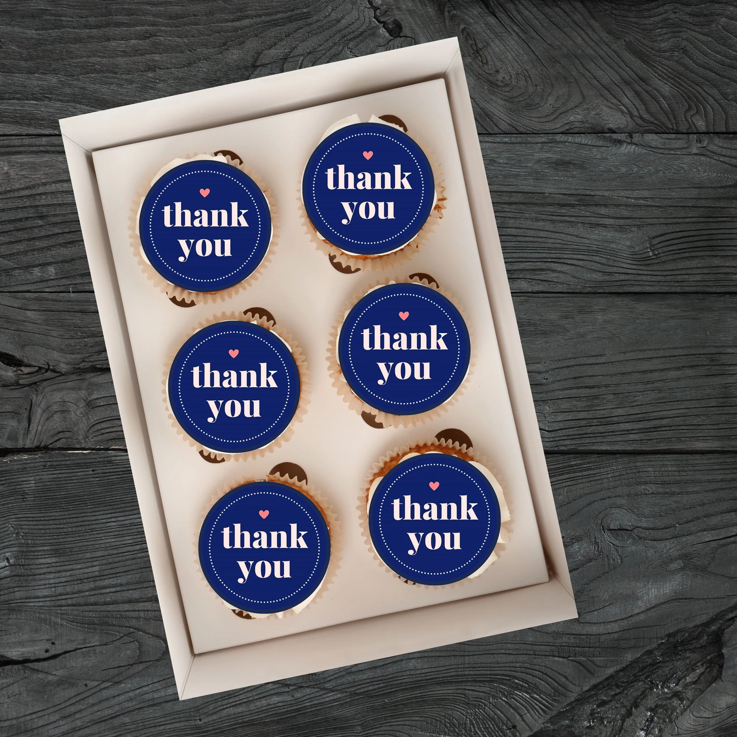 Thank You Blue Edible Cupcake Toppers on cupcakes with white frosting