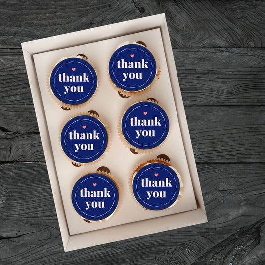 Thank You Blue Edible Cupcake Toppers on cupcakes with white frosting