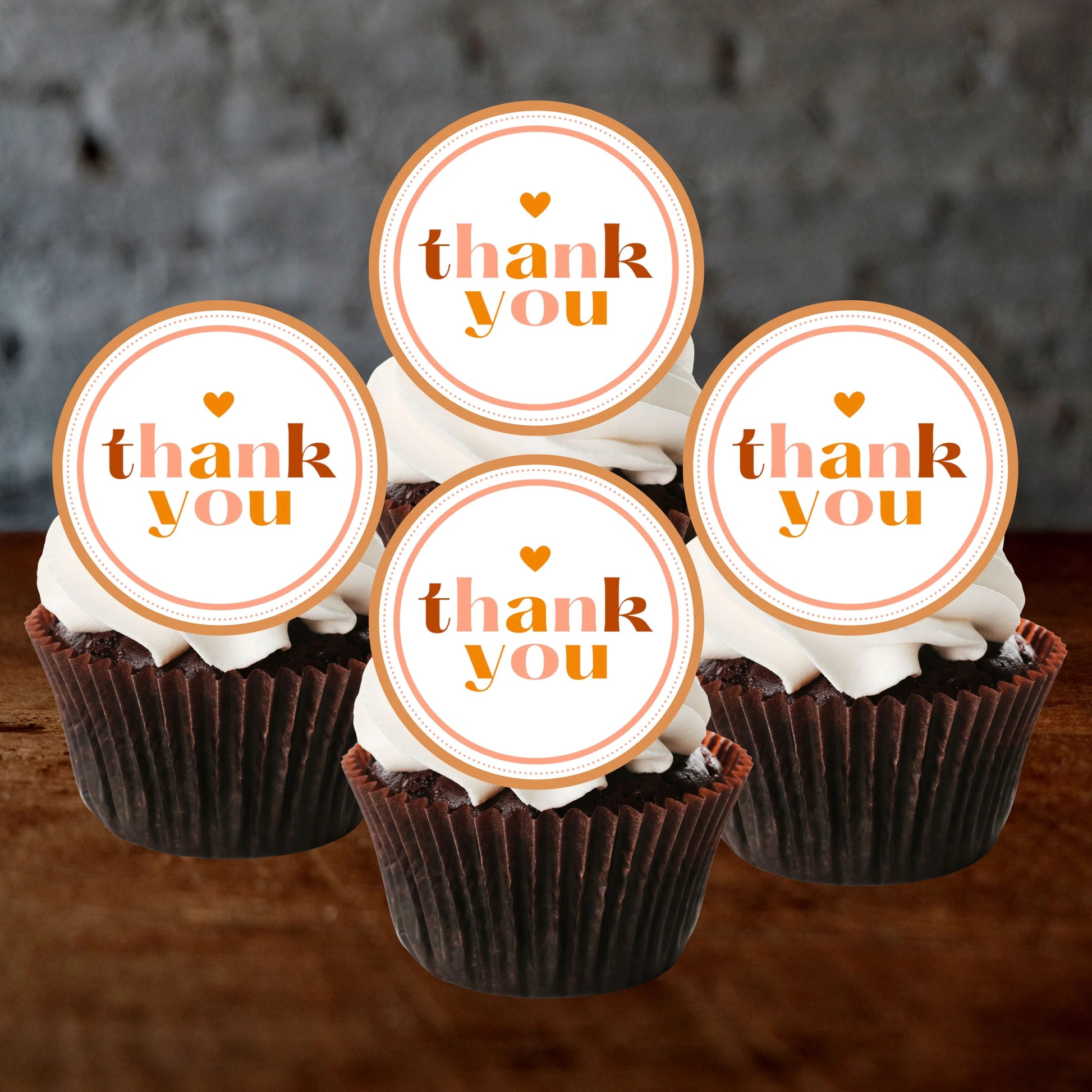 Thank You Gold Cupcake Toppers on chocolate cupcakes with white frosting