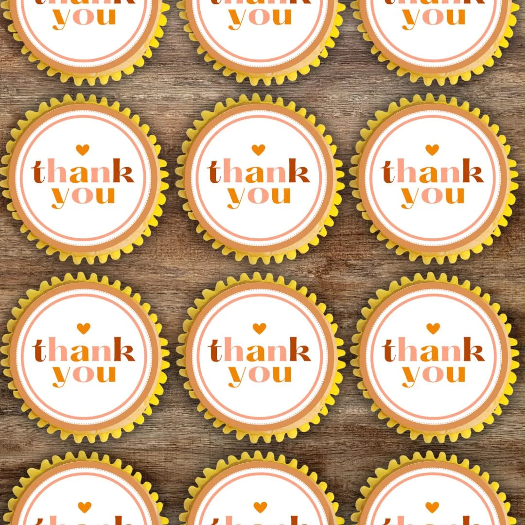 Thank You Gold Cupcake Toppers on cupcakes with white frosting