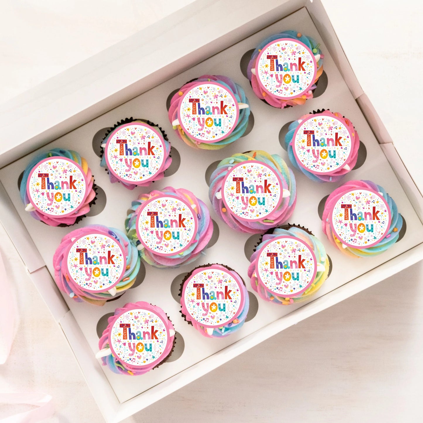 Thank You Pink Cupcake Toppers on rainbow frosted cupcakes