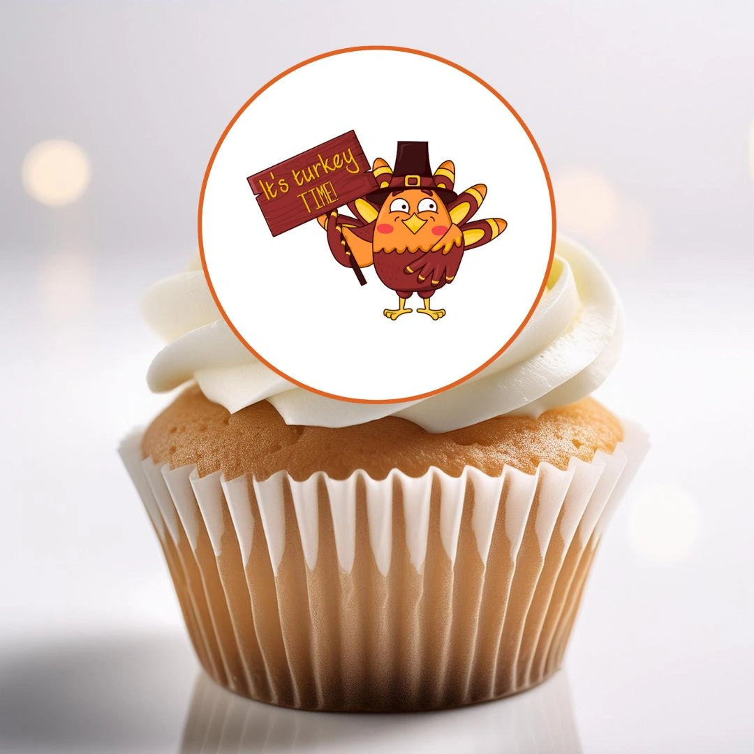 close up of a white frosted cupcake with a Thanksgiving Birds Edible Cupcake Topper on top