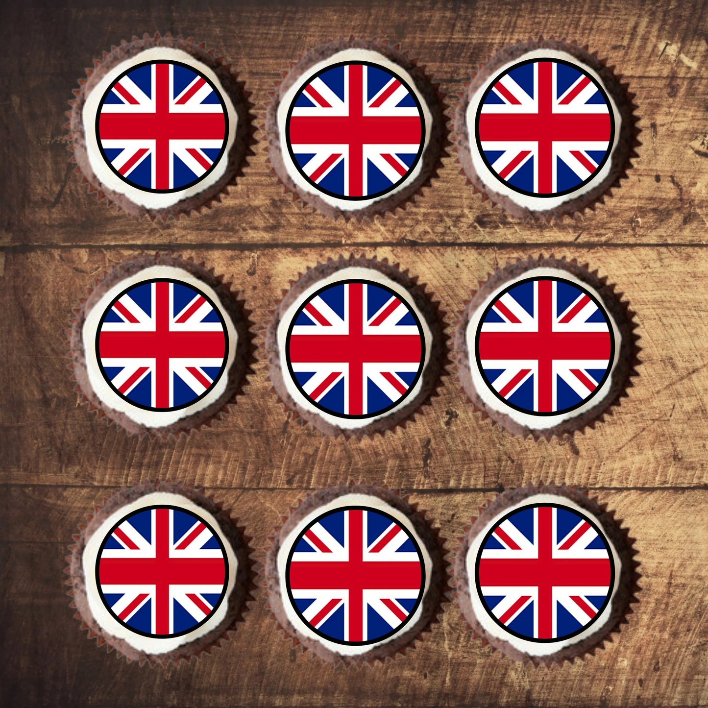 top view of union jack British Flag Round Edible Cupcake Toppers on cupcakes with white frosting