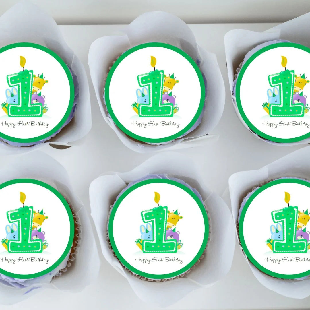 1st Birthday Green Edible Cupcake Toppers with illustrated animals on top of frosted cupcakes