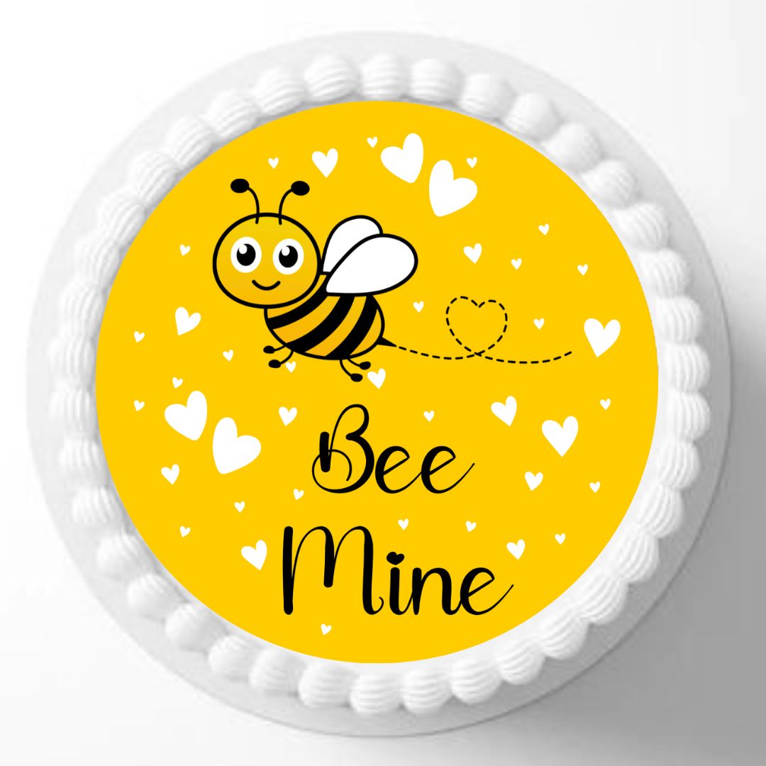 Round cake with a bee and 'Bee Mine' text on a yellow background