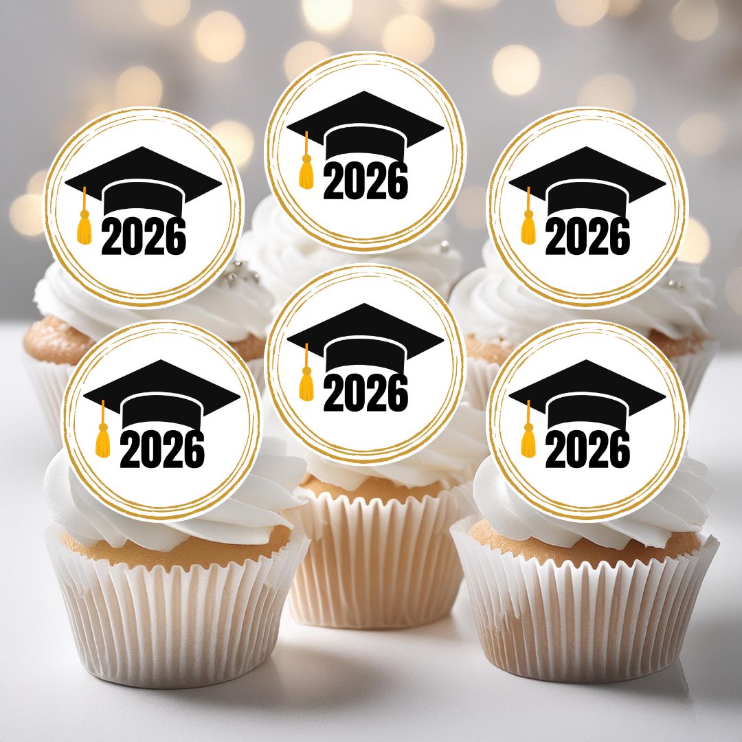 Cupcakes with graduation-themed toppers displaying '2026' on a blurred background