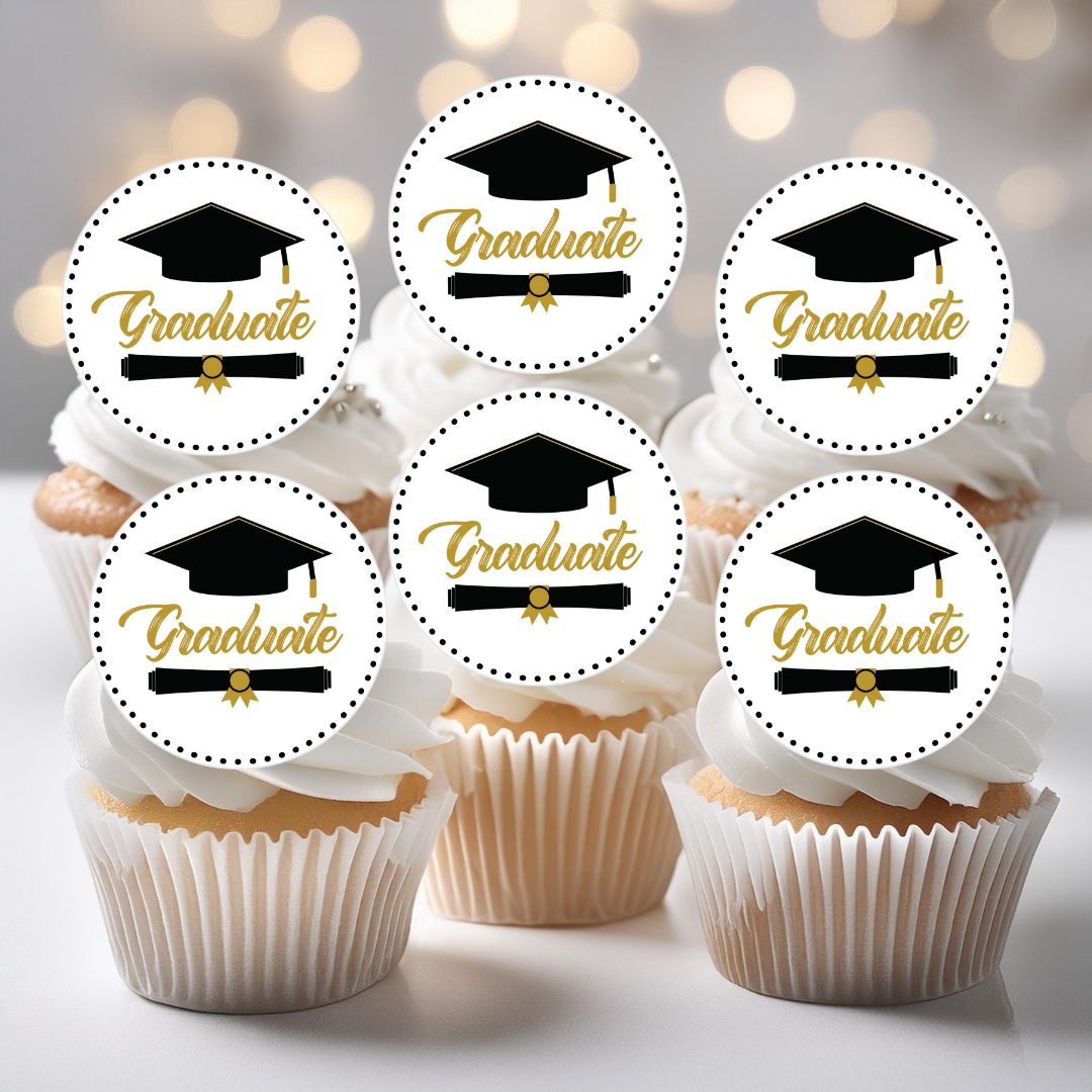 Cupcakes with 'Graduate' toppers on a blurred background