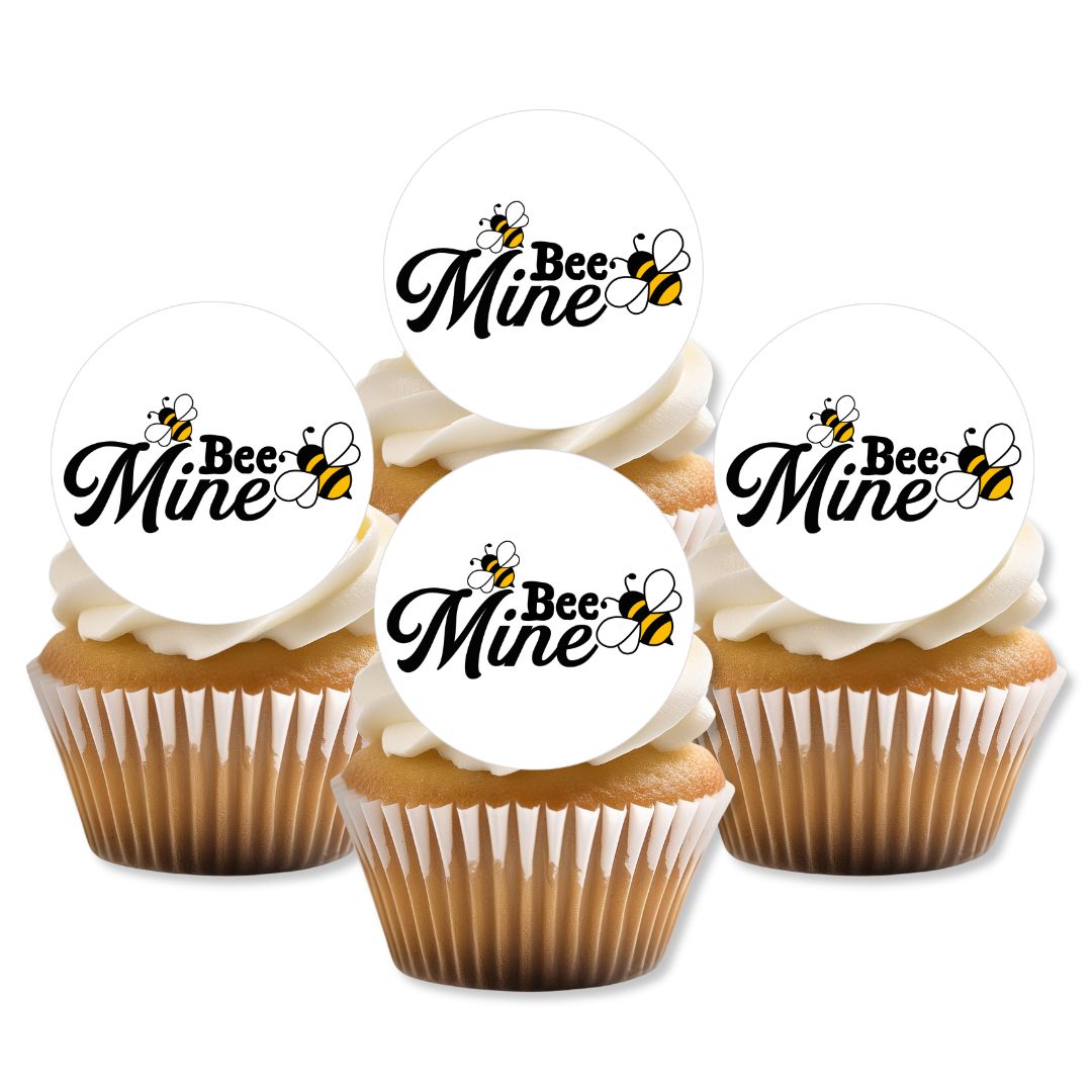 Cupcakes with 'Bee Mine' toppers on a white background