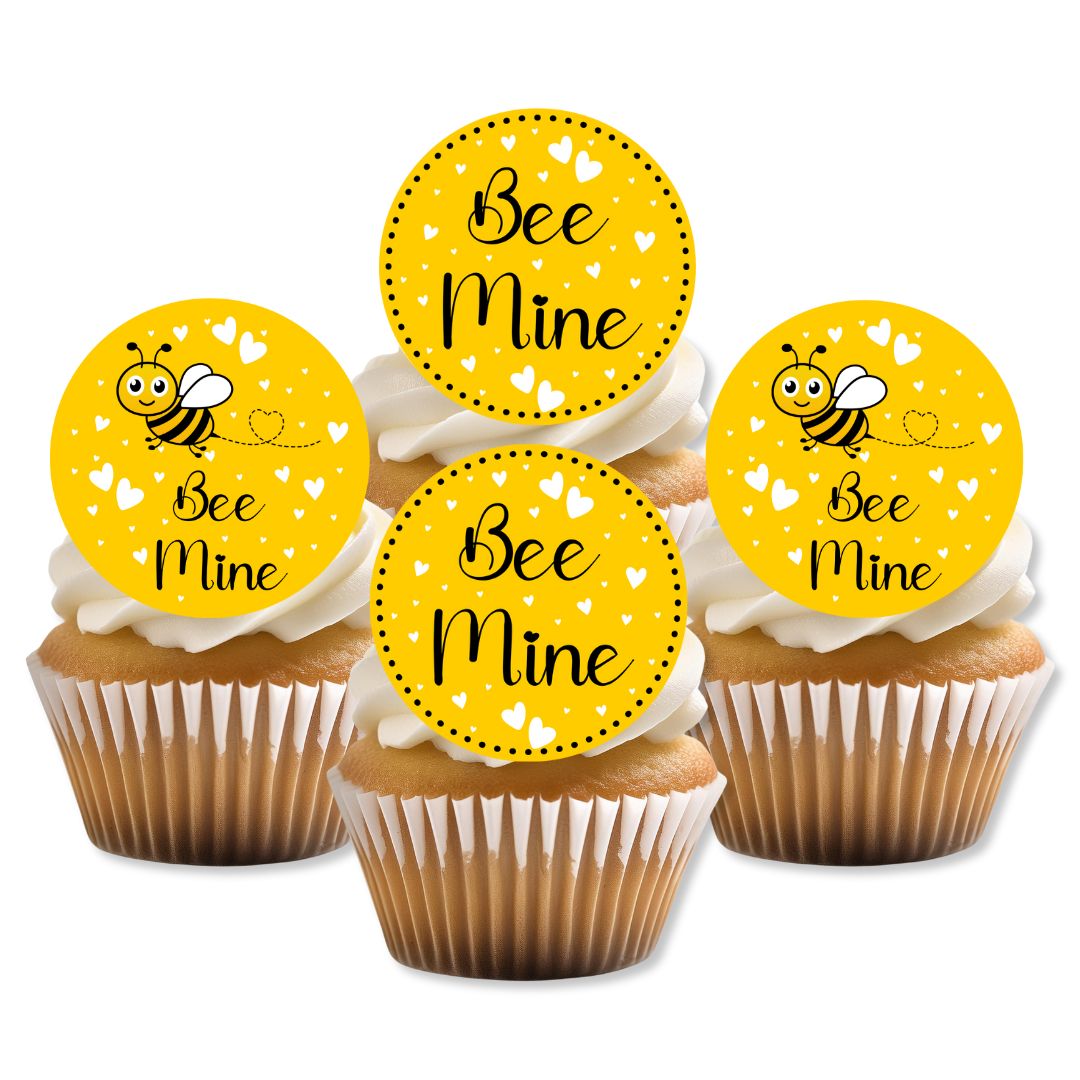 Cupcakes with 'Bee Mine' toppers on a white background