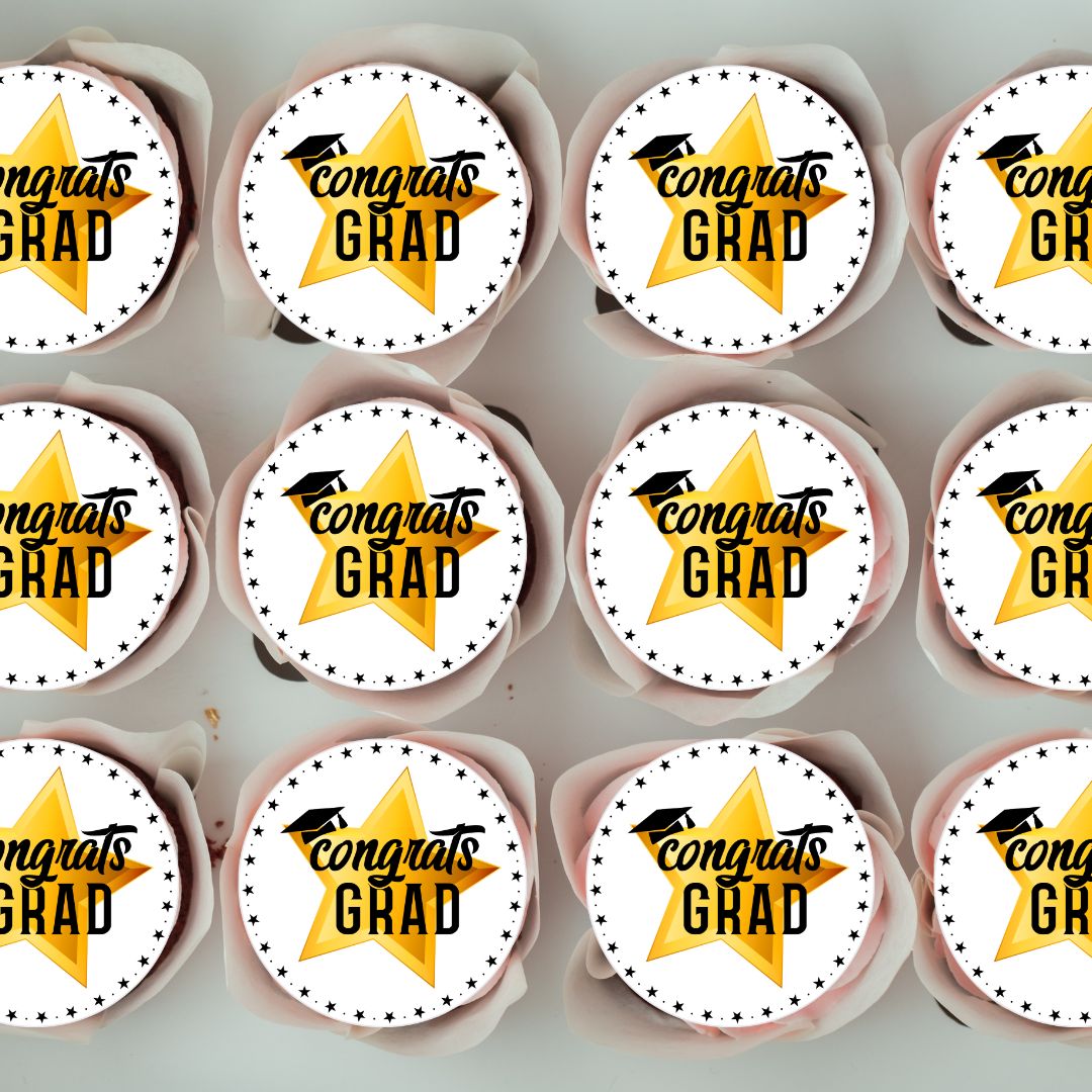 Cupcakes with 'Congrats Grad' toppers on a gray background