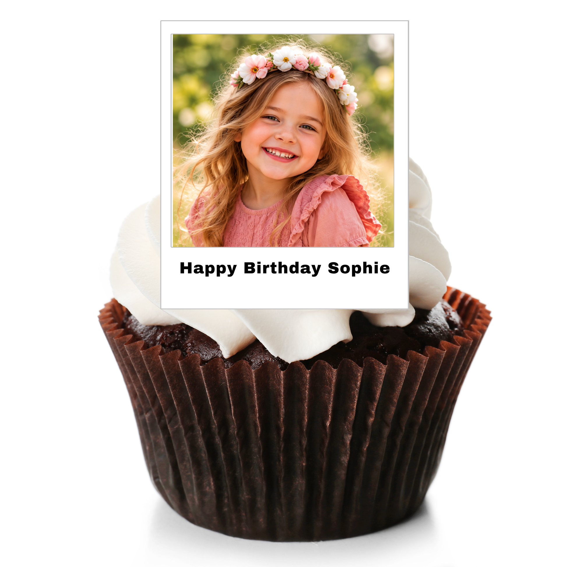 A chocolate cupcake in a brown paper liner with white frosting, topped with a printed photo topper that reads 'Happy Birthday Sophie' against a white background.