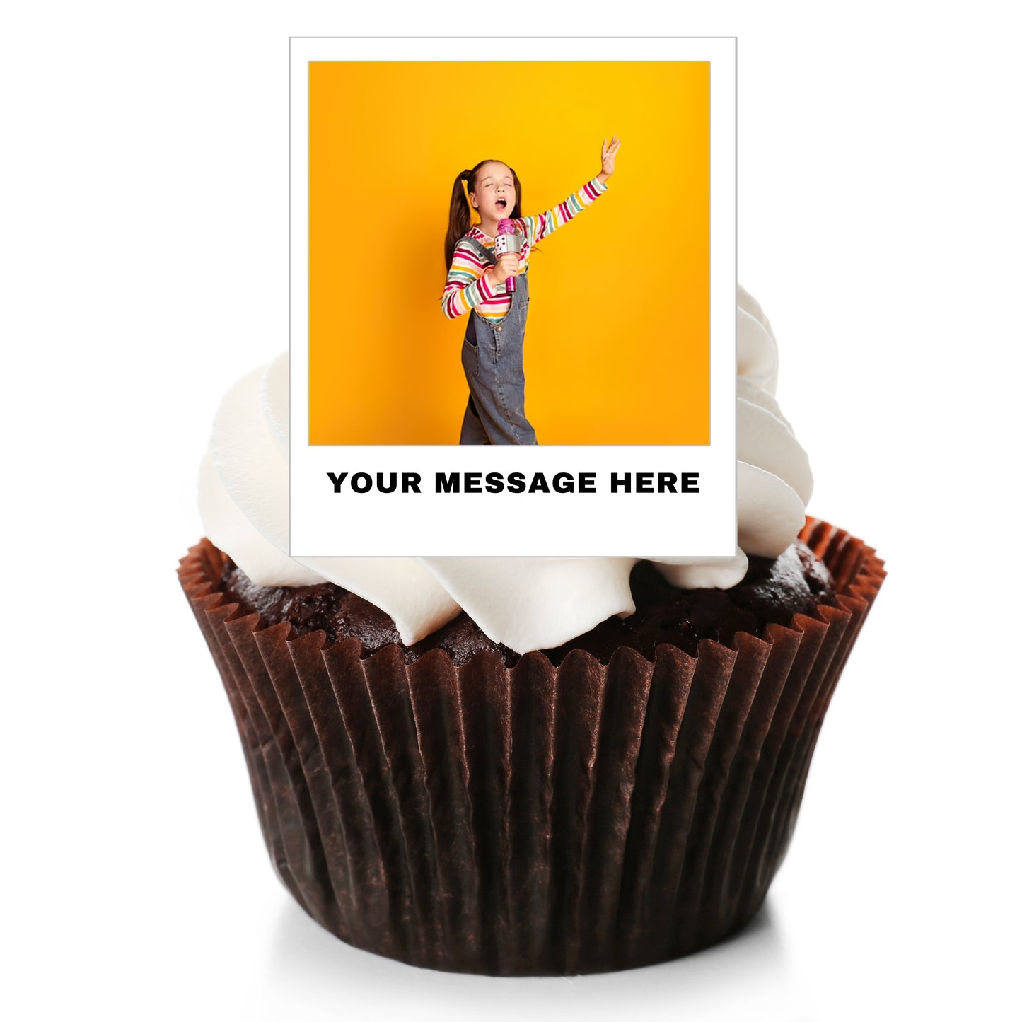 A custom photo cupcake topper displayed on top of a chocolate cupcake with white frosting. The topper features a printed photo of a girl against a yellow background, with the text 'YOUR MESSAGE HERE' below it, all on a clean white background.